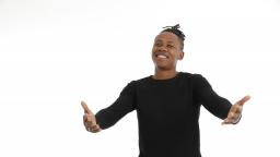 Man in black t-shirt with arms out against white background